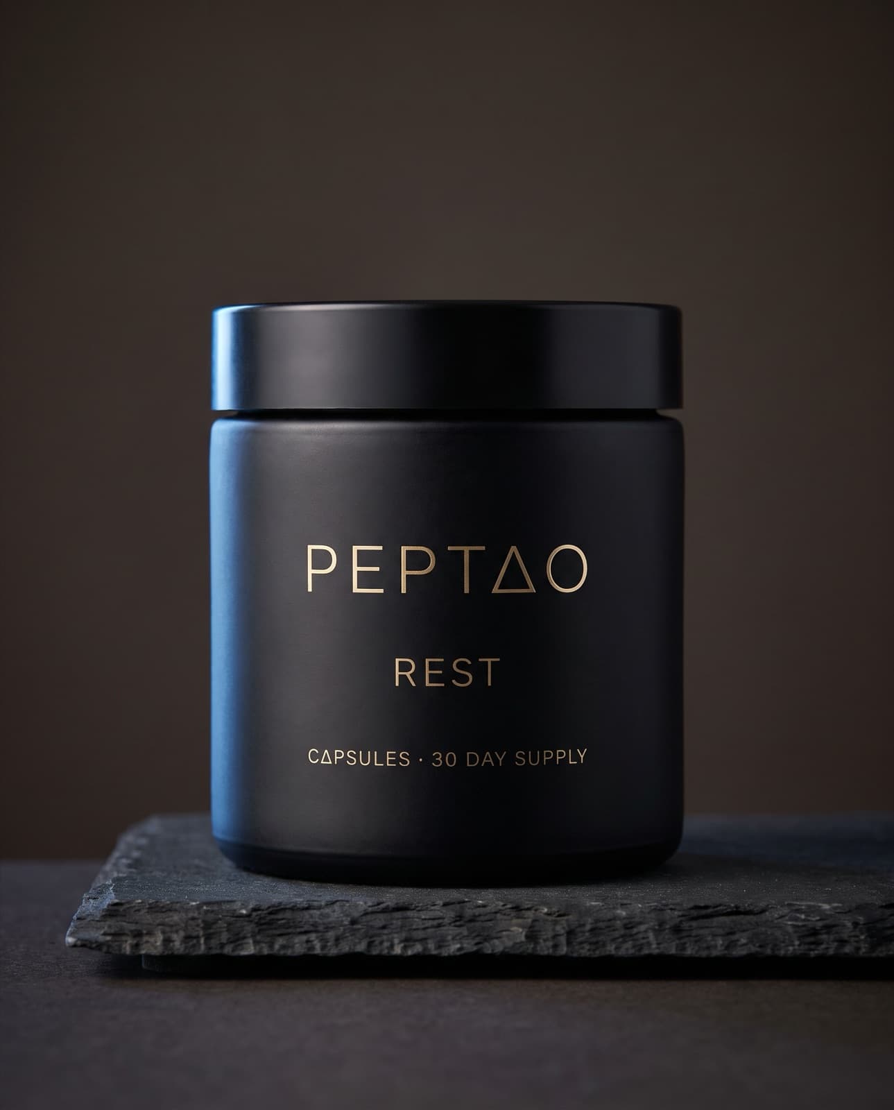 PEPTAO Rest matte black capsule jar on dark slate